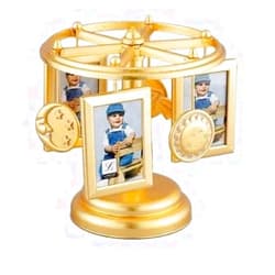 BluePrints Wind Up Musical Carousel Picture Frame - Gold Sun Moon and Stars Design - Holds 6 2x3 Photos