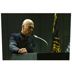 Battlestar Galactica (2004–2009) Modern Colonel Saul Tigh looking concerned speaking at podium - Battlestar Galactica 8x10 Photograph - HQ - BSG