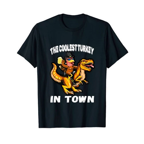 The Coolest Turkey In Town Riding Dinosaur Apparel The Coolest Turkey In Town Turkey Riding Dino Thanksgiving T-Shirt