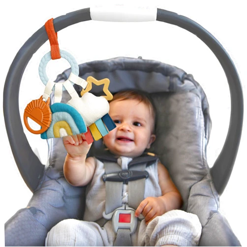 Itzy Ritzy Teething Activity Toy - Bitzy Busy Ring Infant Teething Toy Features Braided Ring & Dangling Toys, Includes Teether, Textured Ribbons, Crinkle Sound & Jingle Bell - 0 Months & Up (Rainbow)