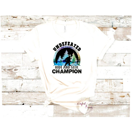 Comfort and Yum Bigfoot Undefeated Hide & Seek Champion - Sasquatch Watercolor Background - Sublimation Transfer Ready to Press Iron On - Yeti Nature Lover