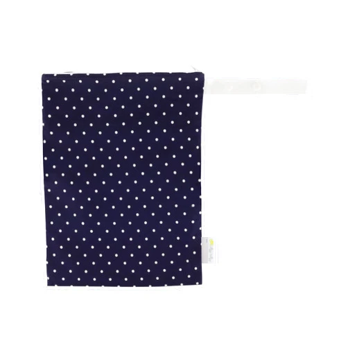 Itzy Ritzy Sealed Wet Bag with Handle – Wet Bag for Travel, Swimsuits, Cloth Diapers, Gym Clothes & Toiletries - Washable & Reusable with Water Resistant Lining - Measures 11” x 14” (Navy Dots)