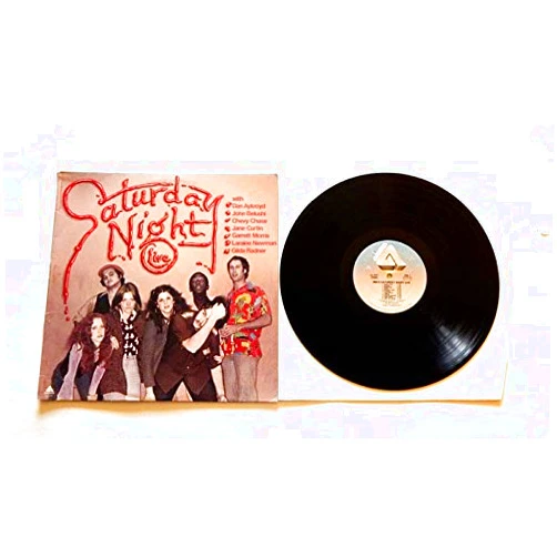 SATURDAY NIGHT LIVE - Arista Records 1976 - Vinyl LP Record - John Belushi , Chevy Chase , Dan Aykroyd , Jane Curtin , Garrett Morris, Laraine Newman and Gilda Radner , Paul Simon