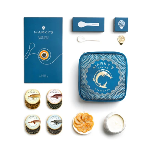 MARKY'S Curated Caviar Tasting Gift Set - 0.5 oz / 14 g (Pack of 4) x Kaluga Royal Amber Caviar, Hackleback Caviar, Siberian Sturgeon Caviar, White Sturgeon Caviar - Caviar Blini - Caviar Serving Set - Spoon, Plate & Tin Opener - Comes with Cooler Gift Bag