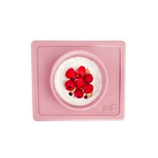 ezpz Mini Bowl (Blush) - 100% Silicone Suction Bowl with Built-in Placemat for Infants + Toddlers - Comes with a Reusable Travel Bag