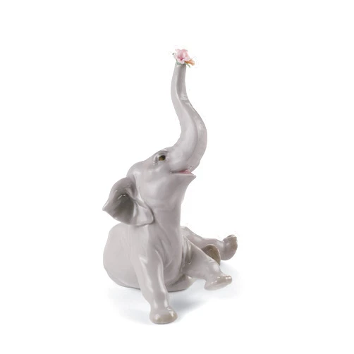 LLADRÓ Glossy Porcelain Figure of Baby Elephant with Pink Flower. Decorative Porcelain Animal Figurine.