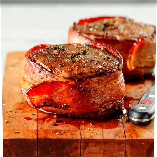 Omaha Steaks The Unforgettable Holiday Gift (Bacon-Wrapped Filet Mignons, Air-Chilled Boneless Chicken Breasts, Omaha Steaks Burgers, Gourmet Jumbo Franks, Boneless Pork Chops, and more)